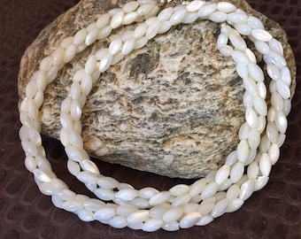 Beautiful mother of pearl braided beads choker necklace .