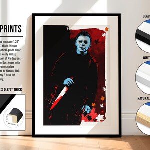 May include: Framed print of a horror movie character with a knife. The character is wearing a black jacket and has a blue face. The background is red with falling leaves. The frame is available in black, white, or natural oak. The frame is 1.25 inches wide and 0.875 inches thick.