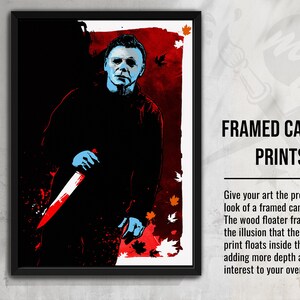 May include: A framed canvas print featuring a stylized illustration of a horror movie character holding a knife. The background is a red and orange color with a splattered effect. The text "FRAMED CANVAS PRINTS" is visible at the top of the image.