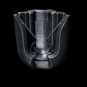 May include: A black, 3D-printed object with a complex, geometric design. The object has a central cylindrical core with vertical ridges and two curved, wing-like structures extending outwards. The overall shape is symmetrical, with a matte finish and visible layer lines.