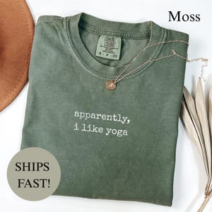 Green Comfort Colors t-shirt with "apparently, i like yoga" text.