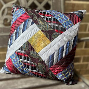 May include: A white ceramic mug with a black handle and the text "But First, Coffee" in a bold, black font. The mug is sitting on a wooden surface. The mug is approximately 4 inches tall.