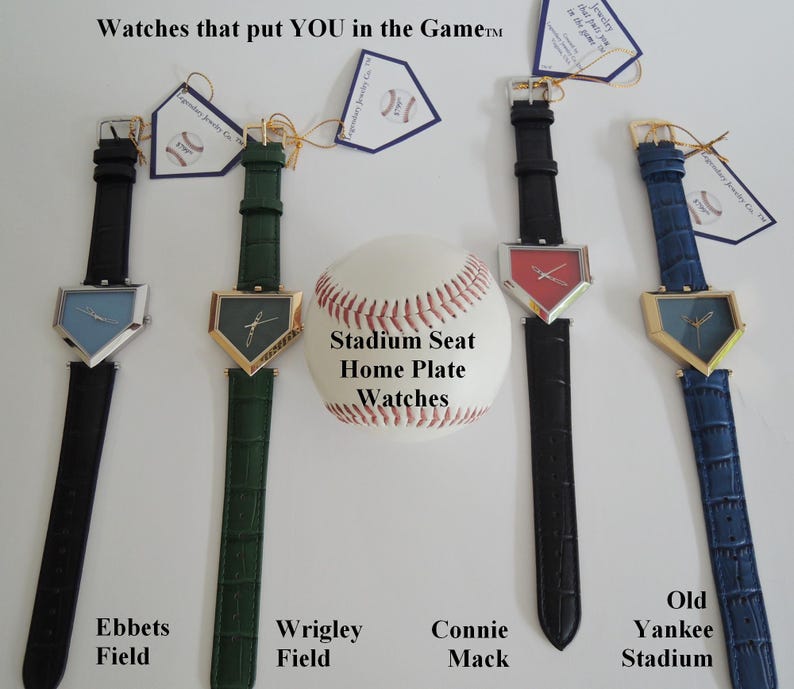 May include: Four wristwatches with home plate-shaped faces and textured leather straps in black, green, black, and blue. A baseball sits in the center with the text Stadium Seat Home Plate Watches. Each watch has a tag labeled Ebbets Field, Wrigley Field, Connie Mack, or Old Yankee Stadium.