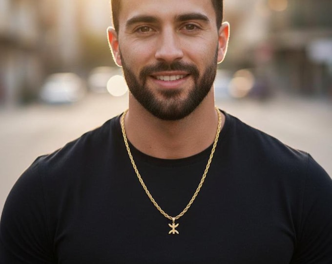 Collier en acier inoxydable doré - symbole Yaz, emblème amazigh. Chaîne torsadée solide de 55 cm et pendentif de 2 cm bélière comprise.