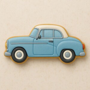 May include: A light blue vintage car cookie with a white top and tan outline. The car has black tires with white centers, gray accents, and red taillights. The cookie is a classic car shape.