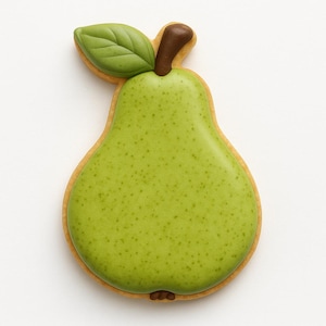 May include: A pear-shaped cookie with green icing and a brown stem and leaf. The cookie has a light brown border and a speckled green surface, resembling a real pear. The leaf is a darker shade of green.