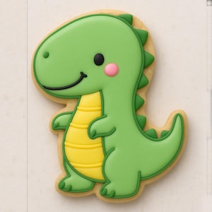 Könnte beinhalten: Ein dekorierter Zuckerkeks in Form eines grünen Dinosauriers. Der Dinosaurier hat einen gelben Bauch, eine rosa Wange und einen lächelnden schwarzen Mund. Der Keks ist grün umrandet und liegt auf einer hellen Oberfläche.
