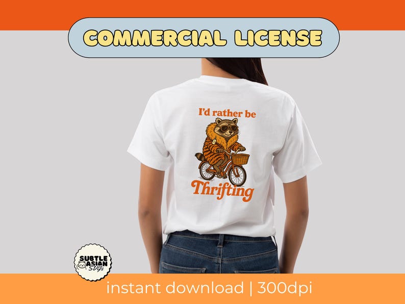 May include: White t-shirt with a raccoon graphic riding a bicycle with a basket. The raccoon wears sunglasses and a striped jacket. Text on the shirt reads "I'd rather be thrifting" in orange. The image includes the words "Commercial License" and "instant download | 300dpi".