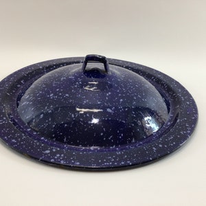 May include: A blue enamel lid with a white speckled pattern and a metal handle.