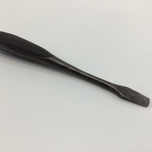 May include: A set of three ceramic mugs with a speckled, matte finish. The mugs are in shades of cream, light gray, and dark gray. Each mug has a simple, minimalist design, perfect for coffee or tea.