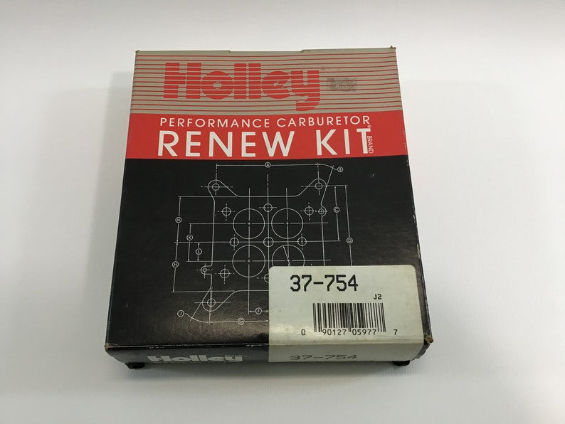 May include: A black and white box with the text "Holley Performance Carburetor Renew Kit" and a diagram of a carburetor. The box also has a white label with the text "37-754" and a barcode.