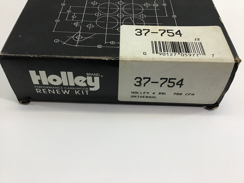 May include: A black and white box with the Holley brand logo and the text "Performance Carburetor Renew Kit" and the part number "37-754". The box also includes the text "Holley 4 BBL Universal 788 CFH".