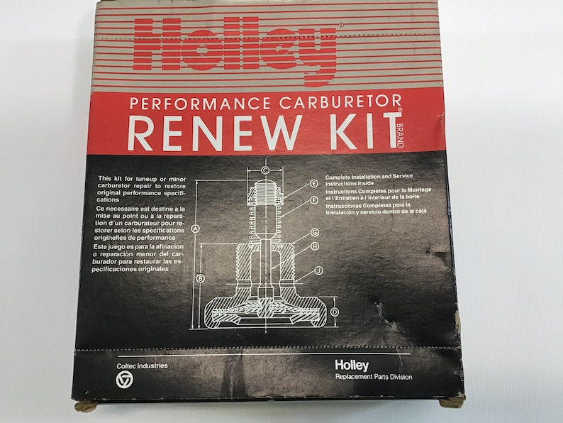May include: A black and white box with the text "Holley PERFORMANCE CARBURETOR RENEW KIT" in red. The box contains a carburetor rebuild kit for restoring original performance specifications. The box also includes complete installation and service instructions.