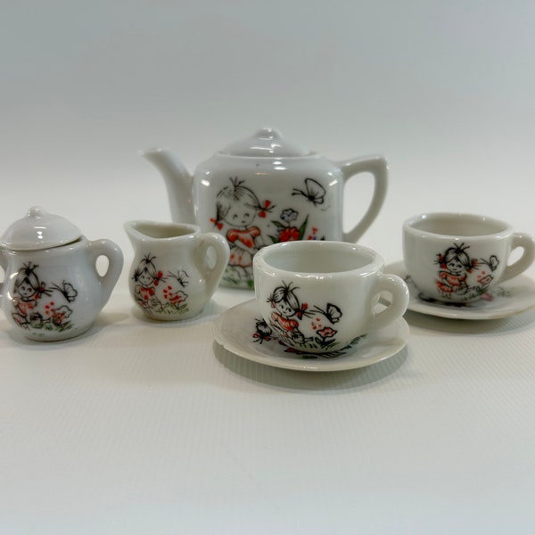 Porcelain Toy Tea Set 7 Pieces 1950's Childs Playset Tiny Dishes With Little Girl in Her Garden