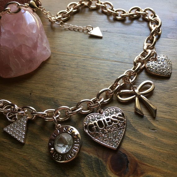 Guess Gold-tone Mixed Crystal, Flower & Butterfly Charm Bracelet