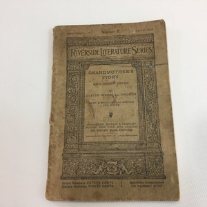 May include: A vintage book cover for "Grandmother's Story and Other Poems" by Oliver Wendell Holmes. The cover is brown with black text and illustrations. The book is part of the Riverside Literature Series.