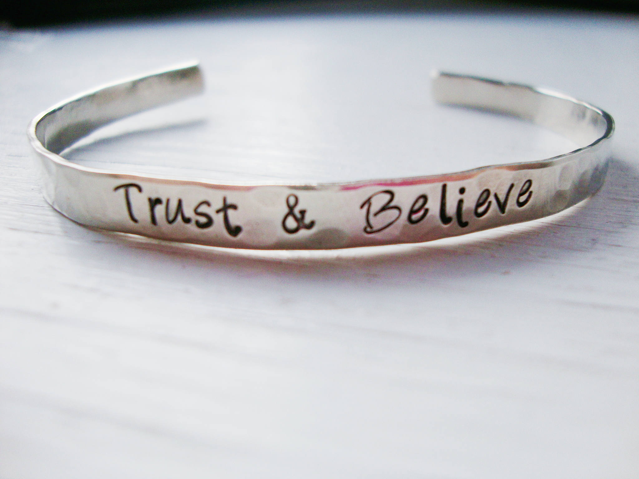 Trust and Believe hand stamped silver cuff bracelet | Etsy