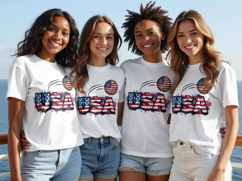 Four women in USA graphic t-shirts stand together, smiling.