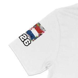 White t-shirt sleeve with "26" and Croatian flag graphic.