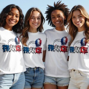 Four young women wear white t-shirts with "FRANCE" and a soccer ball design.