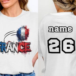 White t-shirt with "FRANCE" graffiti and soccer ball graphic on front.