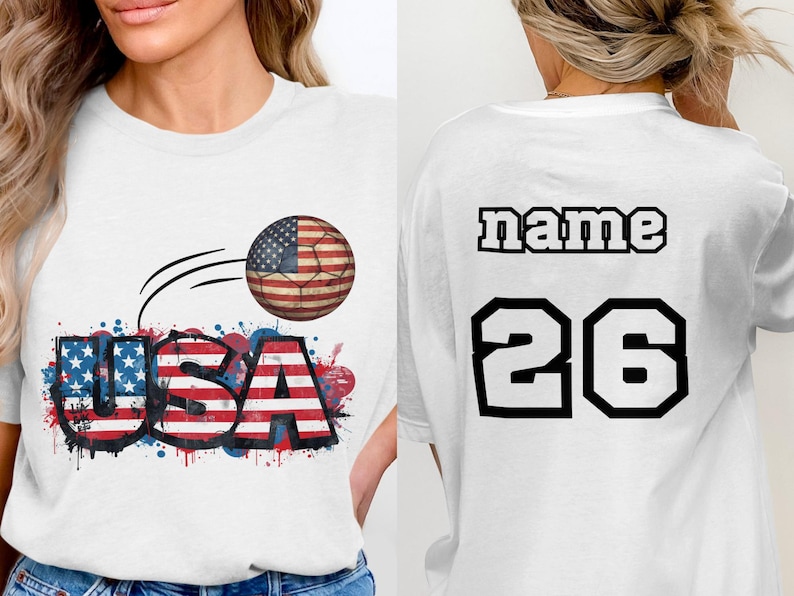 White t-shirt with "USA" soccer ball graphic on front, "name 26" on back.