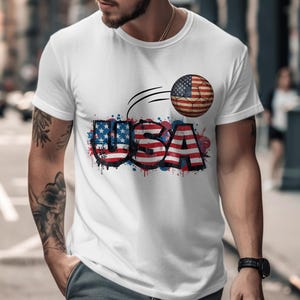 White t-shirt with USA graphic and American flag soccer ball design.