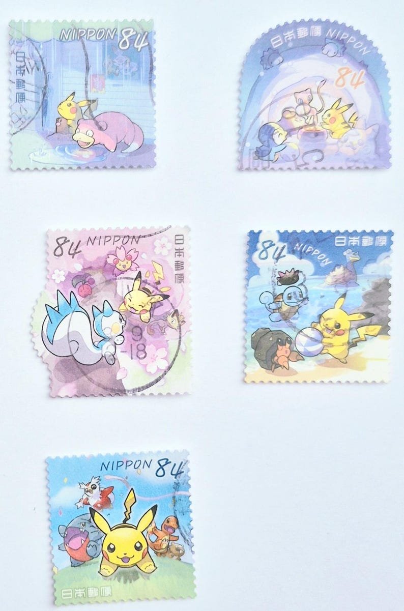 May include: A collection of Japanese postage stamps featuring colorful illustrations of various Pok&eacute;mon characters. Each stamp has the text "NIPPON" and the number "84". The stamps are in various shapes and sizes, with different Pok&eacute;mon depicted.