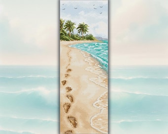 May include: A cross-stitch artwork depicts a beach scene with footprints in the sand leading towards the ocean. Palm trees and green foliage line the shore under a blue sky with birds. The turquoise water meets the sandy beach.