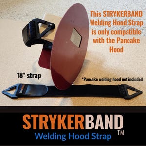 May include: A black STRYKERBAND welding hood strap measuring 18 inches in length, featuring triangular plastic end connectors. The strap is displayed alongside a red circular pancake welding hood. Text states it is compatible with the pancake hood.