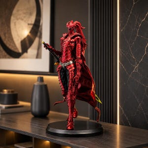 May include: A standing figurine of a warrior clad in metallic red segmented armor with a flowing cape. The figure wears a helmet with a ponytail, holds a long sword at its side, and stands on a circular black base, showcasing intricate details.