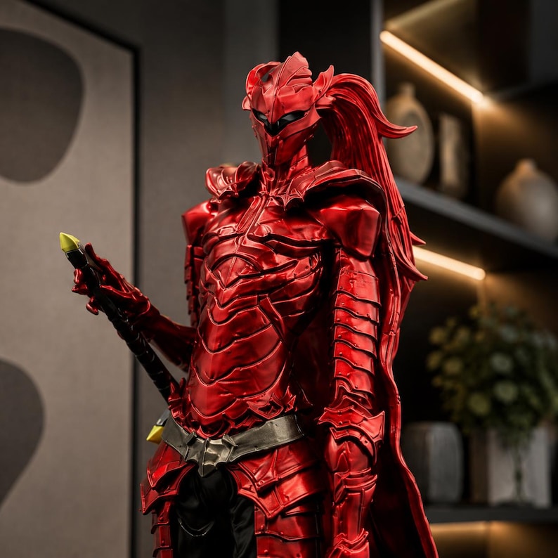 May include: A metallic red armored figurine featuring a sleek, segmented chest plate, shoulder pauldrons, and a helmet with a long, flowing ponytail. The figure holds a black sword with a yellow tip, showcasing intricate, sharp-edged armor plating.
