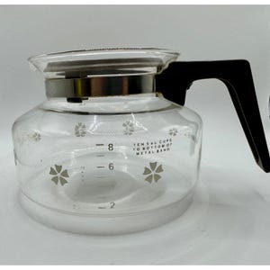 May include: A set of three ceramic nesting bowls in graduating sizes. The bowls are white with a speckled, textured finish and feature a slightly flared rim. The largest bowl measures approximately 8 inches in diameter.