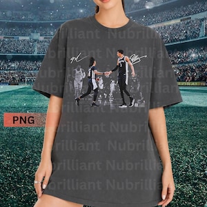 May include: Dark gray t-shirt featuring a basketball player graphic. The graphic shows two players shaking hands, with signatures above. The shirt has a vintage look and a relaxed fit, suitable for casual wear.