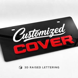 May include: A rectangular black number plate cover featuring the white script text Customized and the red block letter text COVER in 3D raised lettering. The plate has two mounting holes at the top and includes the text 3D RAISED LETTERING.