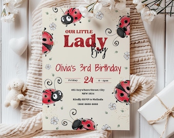 May include: A birthday invitation with a ladybug theme. The invitation features red ladybug illustrations and the text "Our Little Lady Bug" and "Olivia's 3rd Birthday". The date and time are also included.