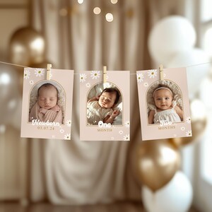 May include: Three baby milestone photo cards suspended from a string. Each card displays a baby photo, daisy details, and text indicating the baby's age: Newborn, One Month, and Two Months. The cards are held by wooden pegs.