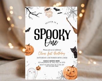 May include: A white Halloween-themed birthday invitation card featuring watercolor illustrations of a mummy, bats, spiderwebs, a broom, a black cat, a ghost, and two jack-o'-lanterns. The text reads: OLIVER IS A SPOOKY One, Please join us to celebrate Olives frst Birthday, SATURDAY | OCTOBER 18TH | 2026, OLIVER S HAUNTED HOUSE 123 anywhere st, any city, st 1235, RSVP TO MELINDA BY JUNE 1ST ON 123.456.7890.