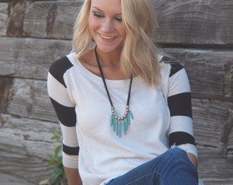 turquoise sticks and black necklace