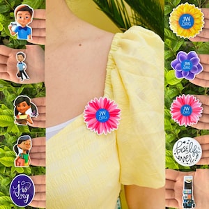 May include: A collection of colorful stickers featuring cartoon characters, floral designs, and the text "JW.ORG" and "Best life ever!". The stickers are held in hands and attached to a yellow blouse.