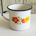 Heather reviewed Enamelware TRES White Blue Trim Floral Cup Mug