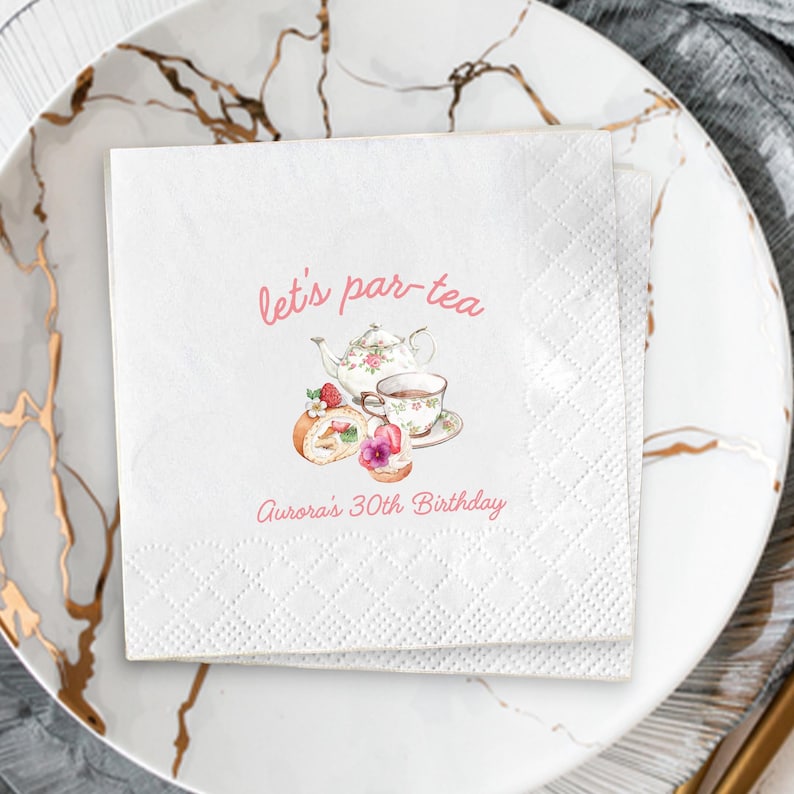 May include: White paper napkins with a diamond pattern, featuring a watercolor illustration of a teapot, teacup, and pastries. The text "let's par-tea" and "Aurora's 30th Birthday" are in pink script.