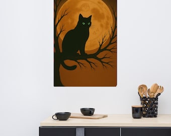 May include: A black cat with green eyes sits on a tree branch in front of a full moon. The artwork is set against a warm orange background. The cat is silhouetted, and the moon has a detailed design.
