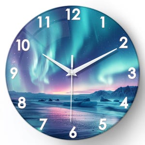 May include: Round wall clock featuring a scenic landscape with a vibrant aurora borealis display in shades of blue, purple, and green. The clock face has white numerals and hands, with a glass-like finish. The clock's design evokes a sense of nature and time.