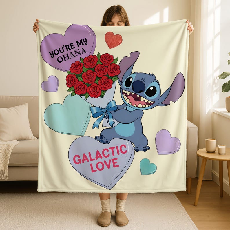 A person is holding up a blanket with a cartoon character, specifically Lilo from the Lilo and Stitch movie, and a bouquet of red roses. The blanket also features a heart and the text "You're my Oana" and "Galactic Love".