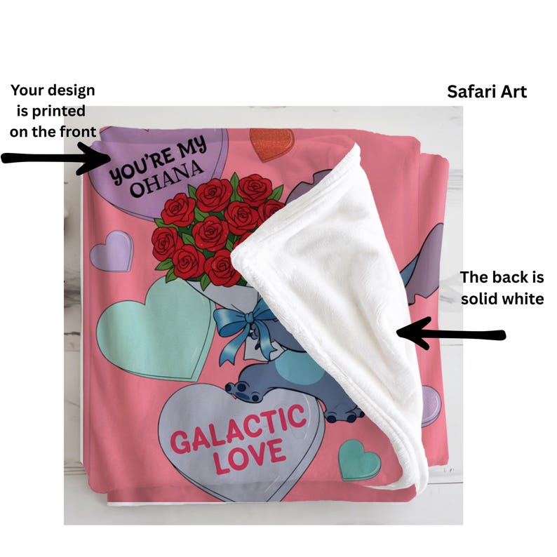 a pink blanket with a cartoon character and a bouquet of red roses. The blanket has a white back and a printed design on the front.