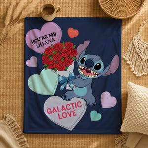 A blue blanket with a cartoon character holding a bouquet of red roses, surrounded by hearts and the text "You're My Ohana" and "Galactic Love".