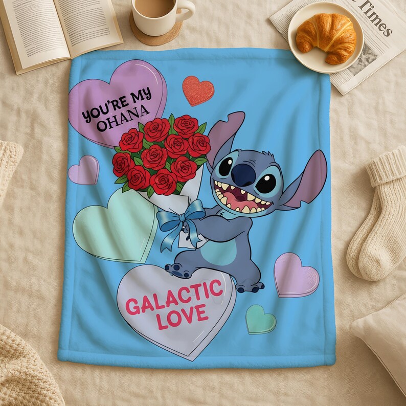 a blue blanket with a cartoon character holding a bouquet of red roses, surrounded by hearts and the text "You're My Ohana" and "Galactic Love".