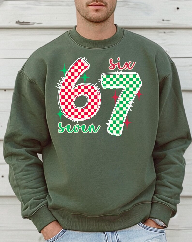 A man wearing a green sweatshirt with the number 67 and the text "six seven" printed on it.
