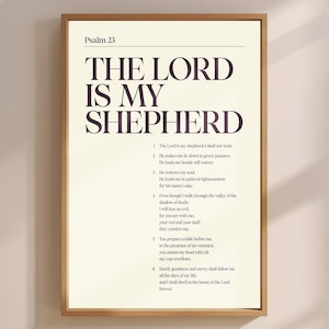 Pode incluir: Uma impressão emoldurada com o texto "Psalm 23" no topo, seguido por "THE LORD IS MY SHEPHERD" em letras grandes e escuras. O texto do Salmo 23 está abaixo em uma fonte menor. A moldura é de cor castanho claro.